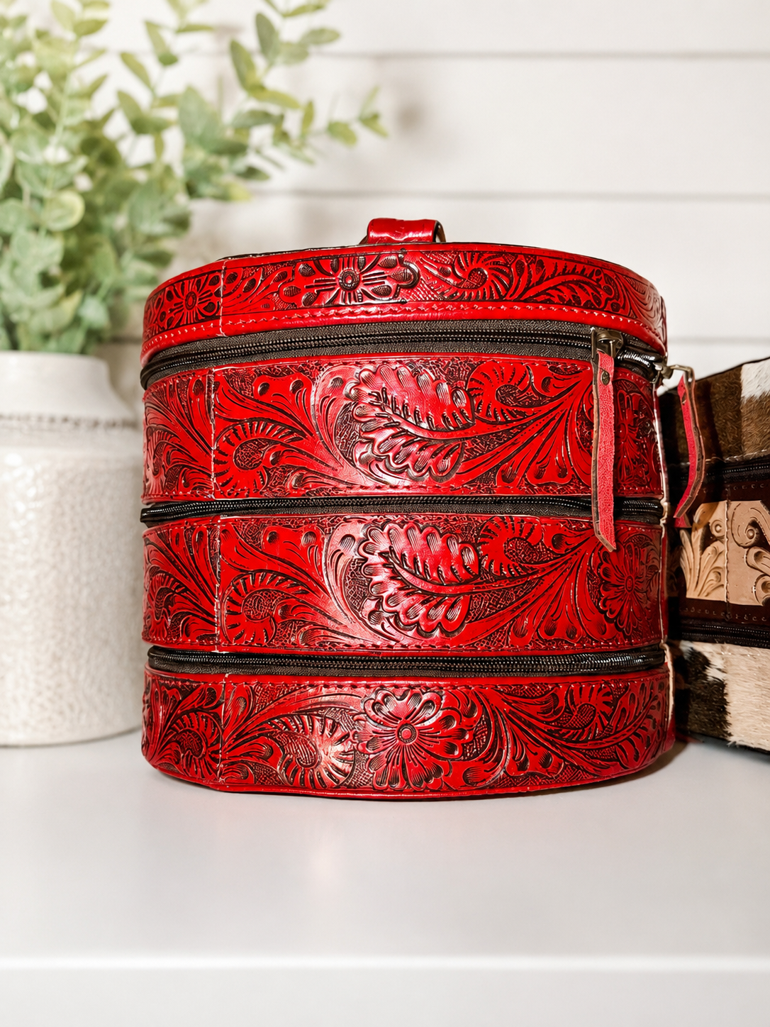 Triple decker jewlery box with top handle.
